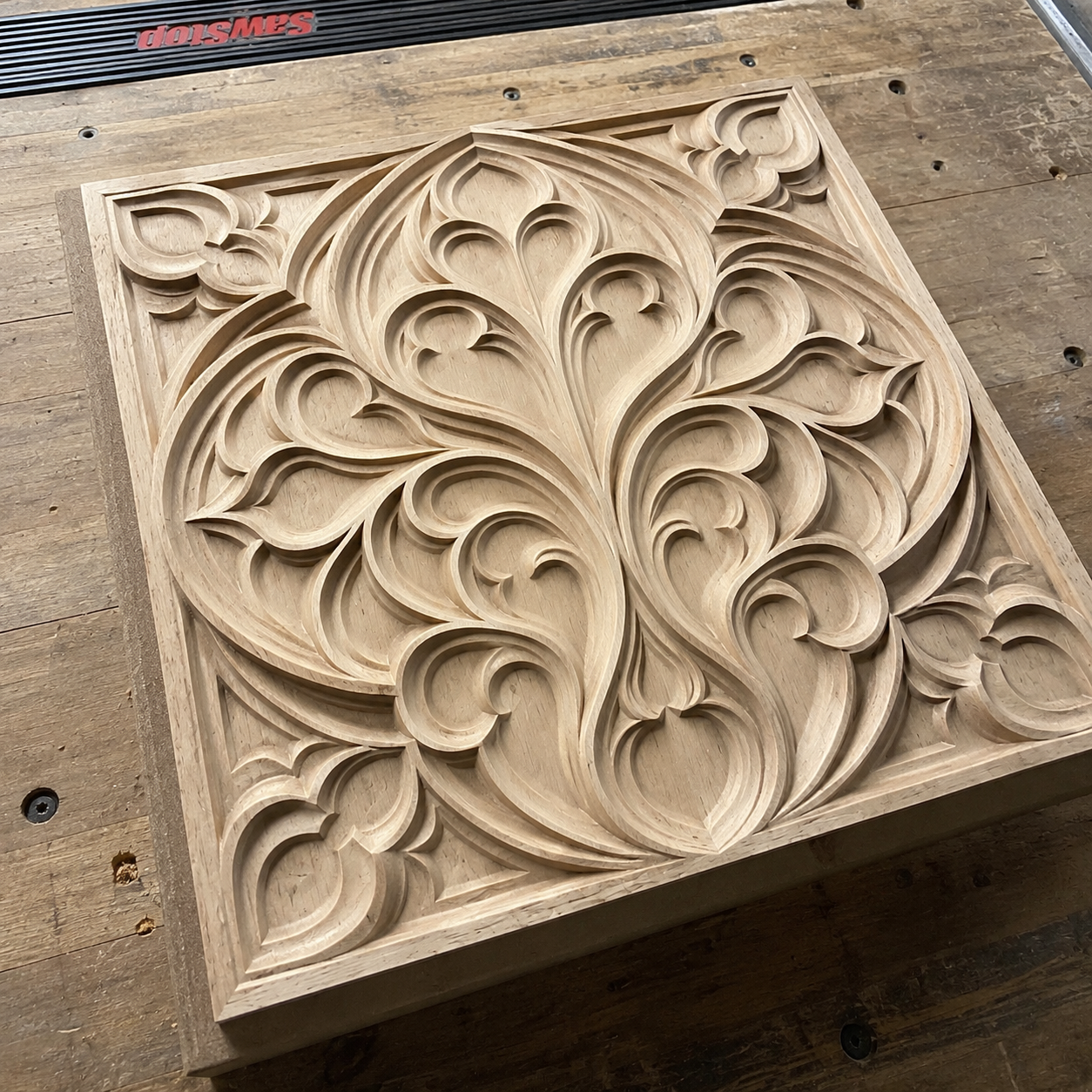 The Decorative Ornament Relief STL File by Form Arcade is a CNC wall art design featuring an intricate, symmetrical floral and leaf pattern, perfect for creating decorative wooden panels.