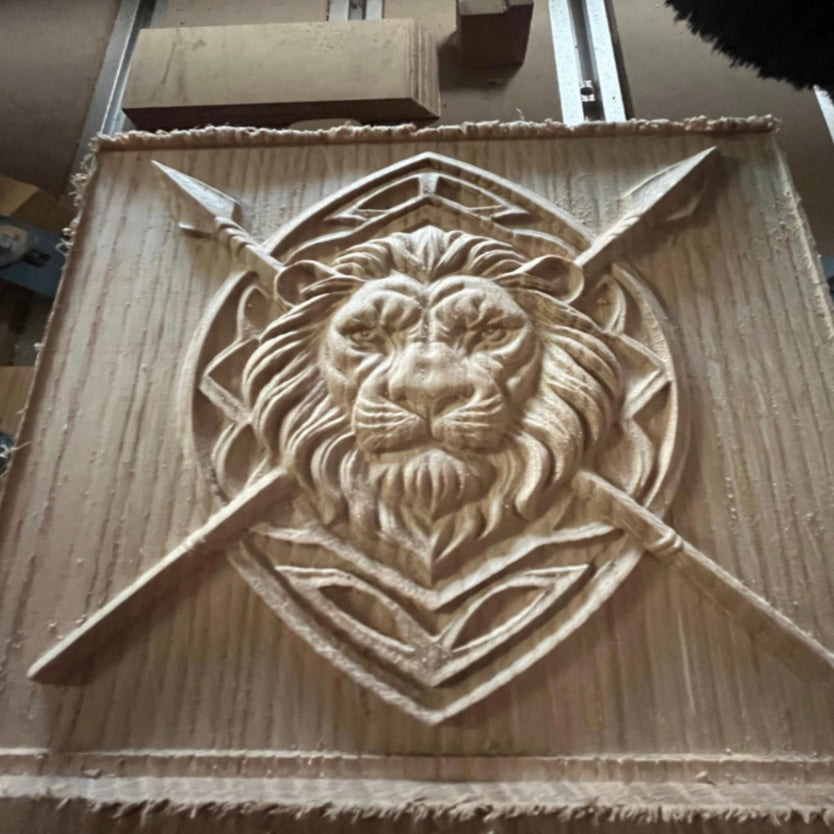 The Lion Relief Collection 8-Pack CNC STL Bundle by Form Arcade features a lion’s head on a shield with crossed spears and a rustic textured background—perfect wall art for your woodworking projects.