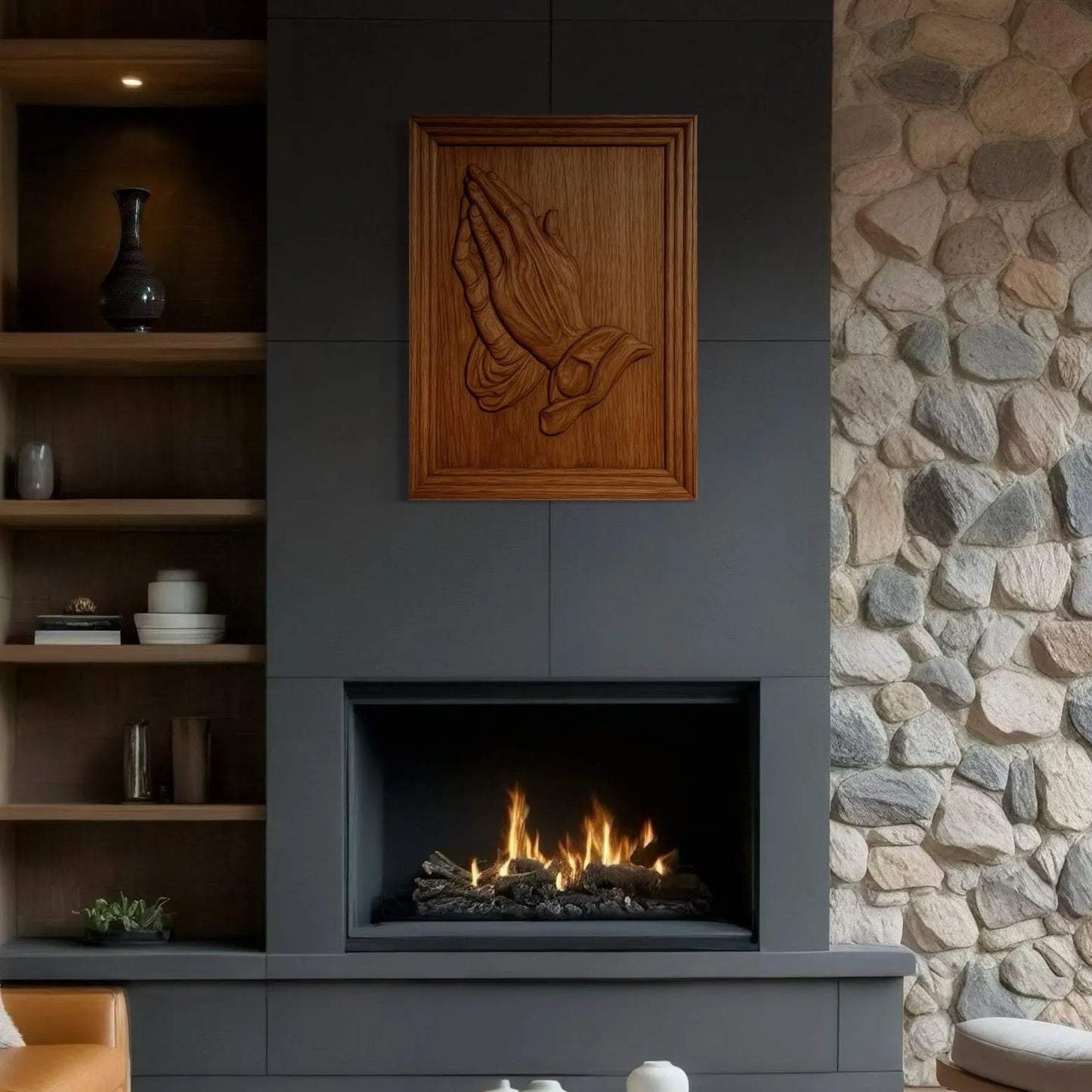 Wooden praying hands relief wall art displayed above fireplace in living room, religious CNC carved decor example