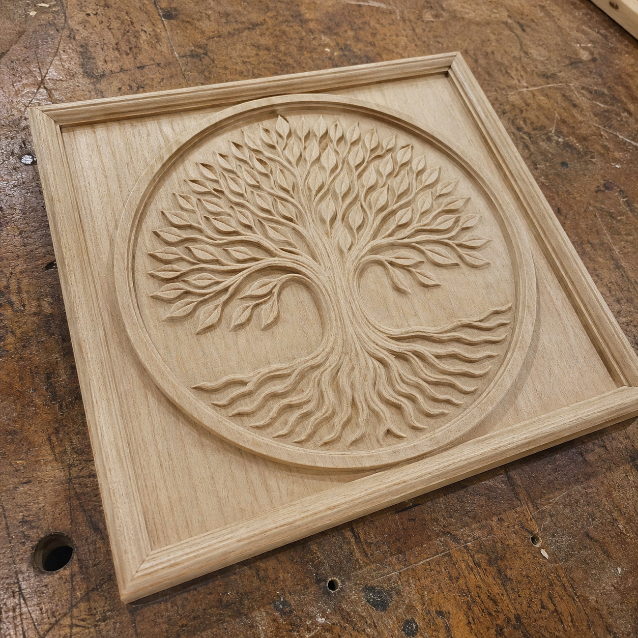 The Tree of Life Relief STL Bundle from Form Arcade features five CNC wall art designs, including a stylized tree with spreading branches and roots inside a circular border, ideal for your creative projects.