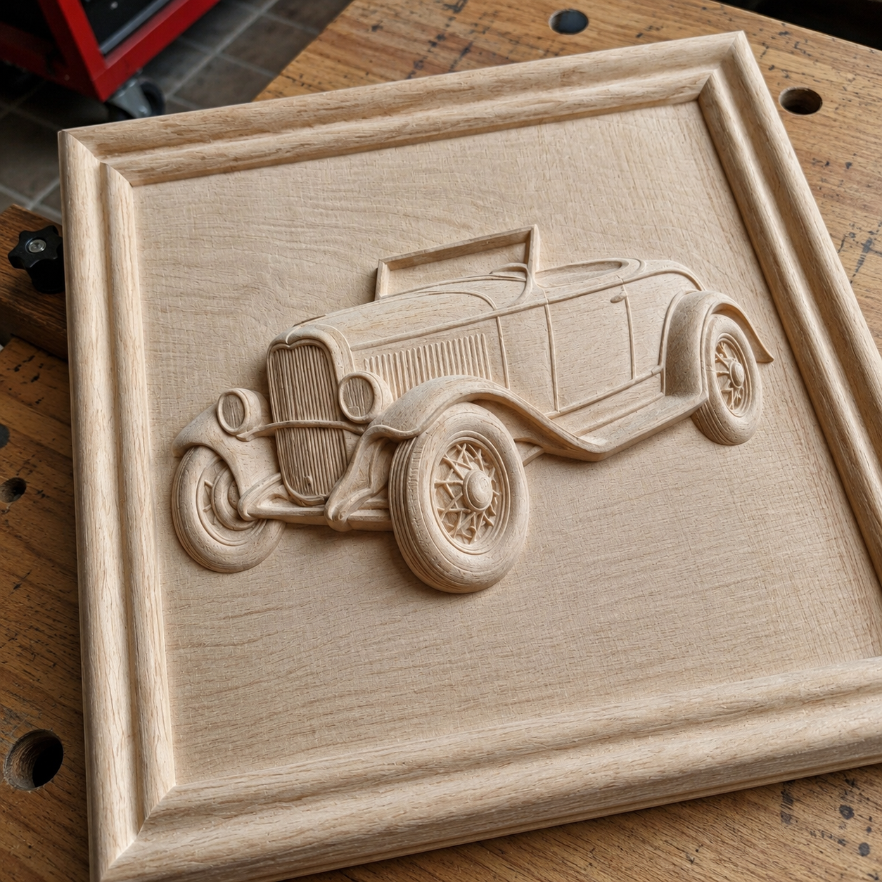 The Vintage Roadster Car Relief STL File by Form Arcade features a CNC wall art design with detailed wheels, headlights, and grill on a rectangular wooden panel framed by a raised border. Perfect for woodworking projects and display.